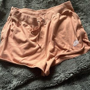 peachy orange Nike shorts size large. No flaws. Has drawstrings